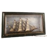 A model of a sailing ship in glazed case