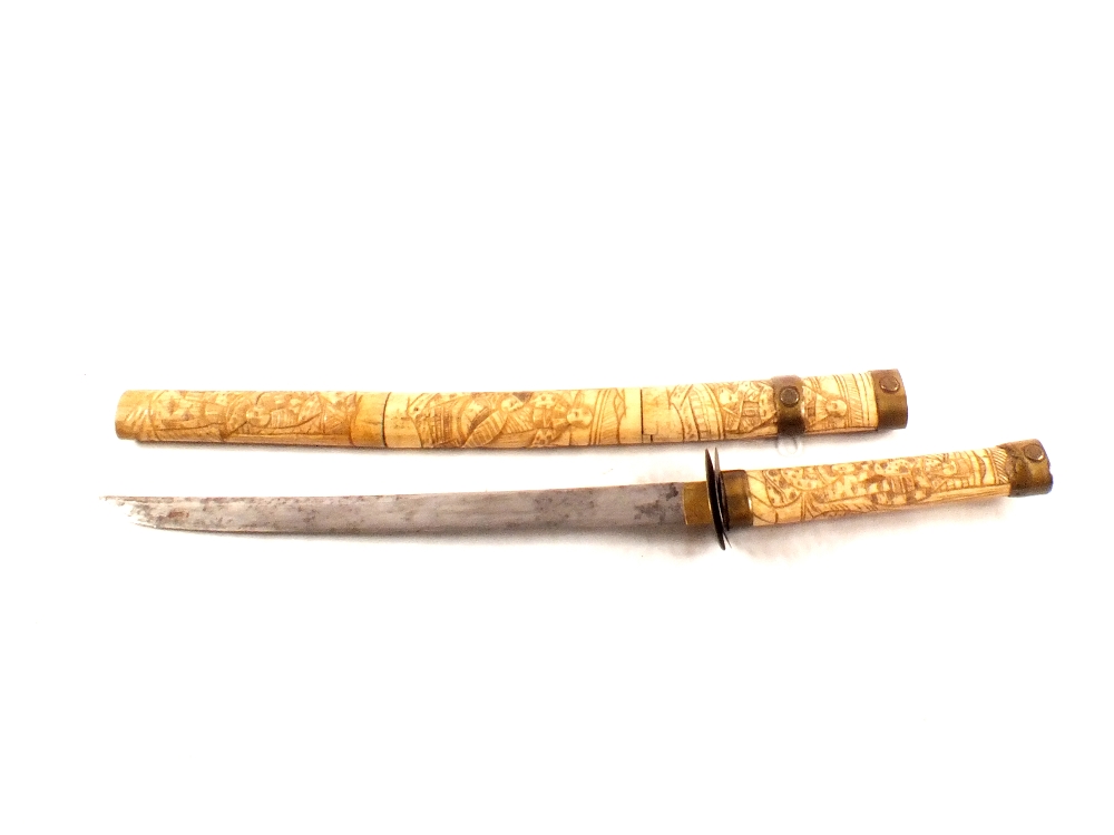 A Japanese Tanto with carved bone hilt and scabbard (as found)