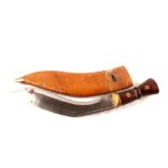 A WWI dated (1917) Kukri with its brown leather sheath