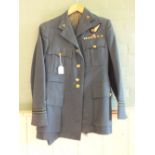 An RAF WWII Navigators uniform including jacket, trousers and hat,