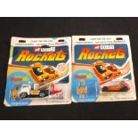 Two Corgi rockets in original packaging,