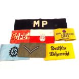 A collection of seven arm bands including Polish,