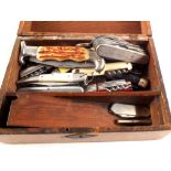 A box of various pocket knives