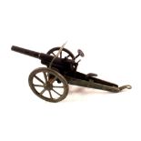 A large tin plate breech loader field gun with cap action and wheeled barrel elevation mechanism