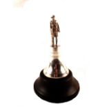 A silver military figure on bell shaped plinth, marked presented to Lt Col J.B.