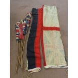 A quantity of various vintage flags some on 'poles'