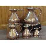 A matched set of five 19th Century graduated seamed copper harvest measures, 4 gallons, 2 gallons,