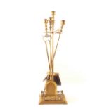 A brass companion set