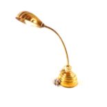 A brass adjustable table lamp with shell shaped shade