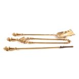A good heavy set of three 19th Century brass fire irons with fluted knop handles