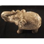 A white metal clad elephant,