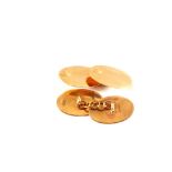 A pair of 9ct gold oval cufflinks with engraved decoration