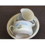 A crinoline lady jug and bowl set plus three jardinieres