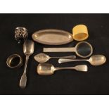 Silver and white metal items including spoons,