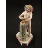 A 19th Century porcelain figure of a winged cherub and column titled 'Je Les Unis',