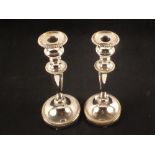 A pair of silver plated candlesticks