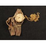 A 9ct gold lady's Tissot wristwatch plus a 9ct gold chain necklace