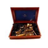 An eighty five piece bronze cutlery set in mahogany case