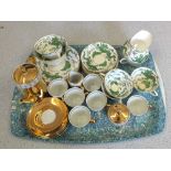 A New Chelsea green dragon decorated part tea set plus a gilt part coffee set