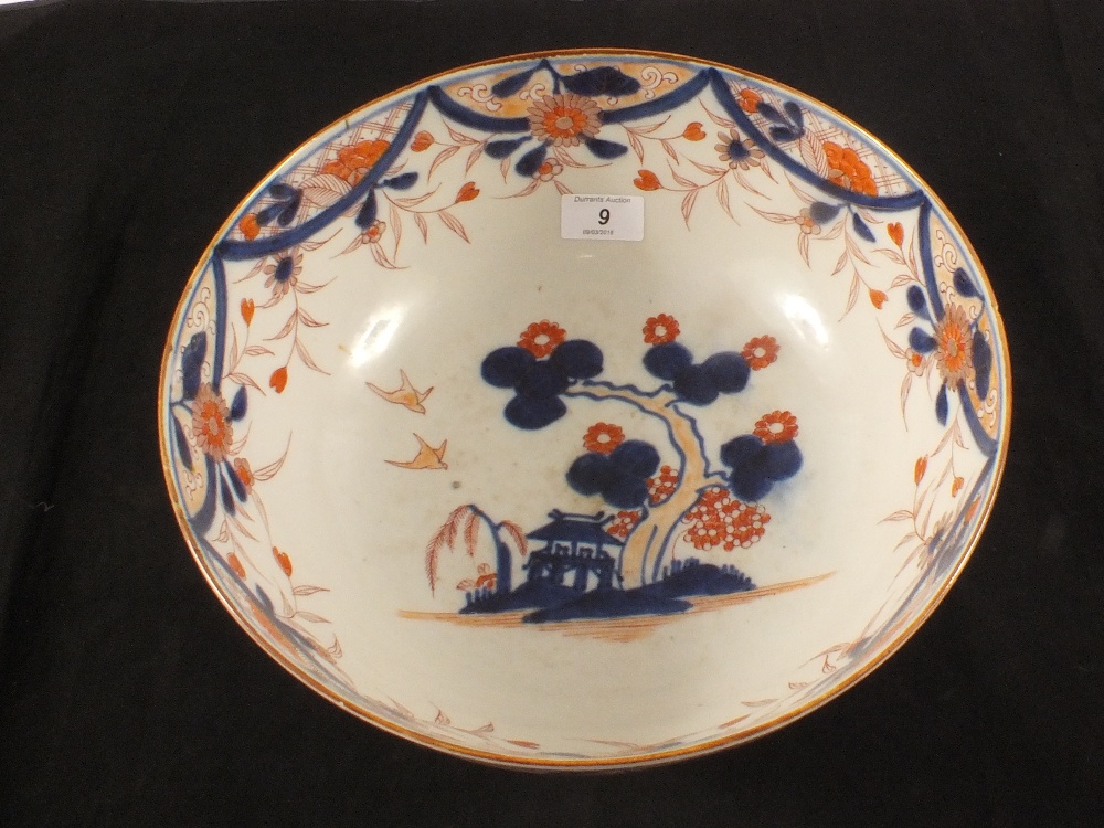 A large 19th Century Chinese porcelain blue and red landscape and floral bowl,