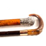 A silver topped walking cane plus a 9ct gold banded cane