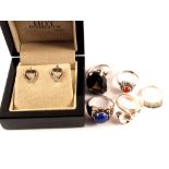 Five various stone set silver rings and a pair of silver heart shaped 'hot diamond' earrings