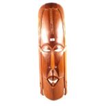 A large African carved wooden mask