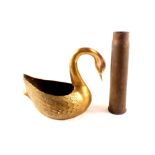 A brass swan plus a shell case