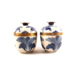 A pair of Chinese blue and white crackleware brass mounted jars and covers,