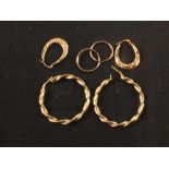 Two pairs of 9ct gold hoop earrings plus a yellow metal pair