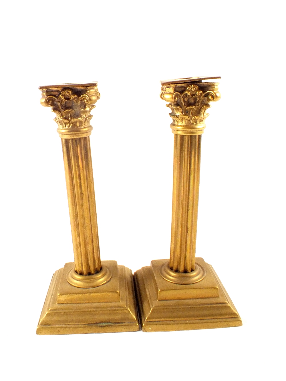 A pair of Victorian brass Corinthian column candlesticks