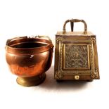 An embossed brass coal box and companion set plus a copper and brass coal helmet