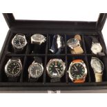 Twenty cased modern military style watches
