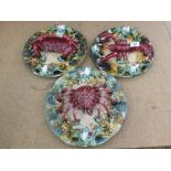 Three modern Palissy plates with lobster and crab decoration