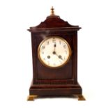 A mahogany cased and brass mounted striking mantel clock