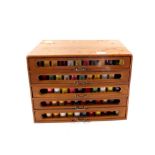 A five drawer haberdashery shop cabinet and contents