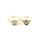 Two 9ct gold rings set with single blue stones