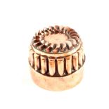 A large Victorian circular copper jelly mould with fluted surround and the top with circle of