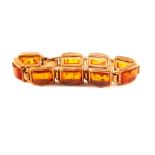 A continental sterling bracelet set with amber pieces