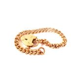 A 9ct gold bracelet (converted from a watch chain) with padlock heart shaped clasp,