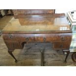 A walnut bedroom suite comprising of a chest of four drawers and a dressing table with four drawers