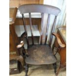 A 19th Century mahogany wall mirror with scroll top and bottom plus an elm Windsor chair