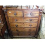 A Victorian mahogany chest of two short and four long drawers flanked by columns