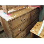 A light oak chest of two short and two long drawers