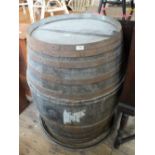 A very large oak and metal bound brandy barrel