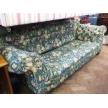 A Victorian style florally upholstered three seater Chesterfield sofa