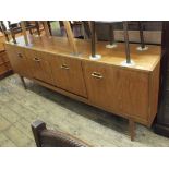 A Nathan Danish style teak sideboard with three drawers and three cupboards on square tapered legs,