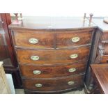 A Victorian mahogany bow fronted chest of two short and three long drawers,