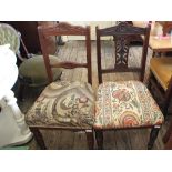 A set of four Edwardian mahogany dining chairs with carved backs plus two others