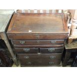 A heavy mahogany bureau with two short drawers,